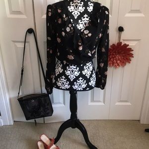 Fun cropped black floral ruffled blouse